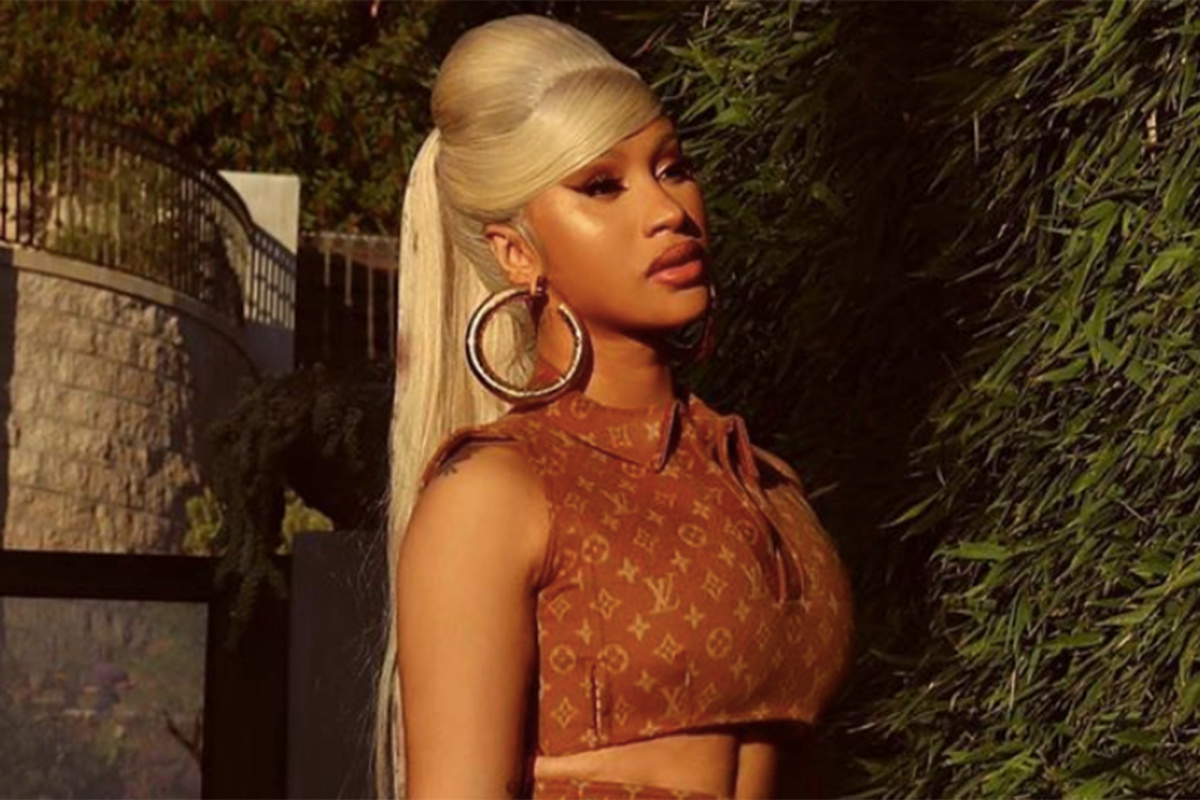 Cardi B’s Louis Vuitton ponytail matches her crop top and skirt.